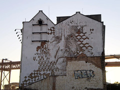 Mural carved by Vhils.