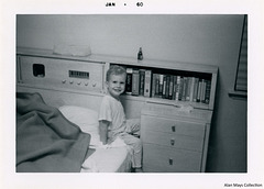 A Boy and a Bedside Bookshelf