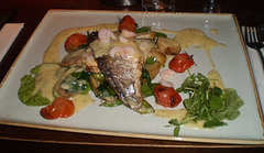 Sea bass with prawns and vegetables.