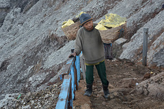 Indonesia, Java, Hard Job of a Porter in the Crater of Ijen Volcano