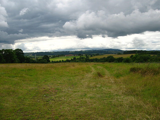 Looking towards the Clee Hills from the B4373 and near the mile post at Nordley.