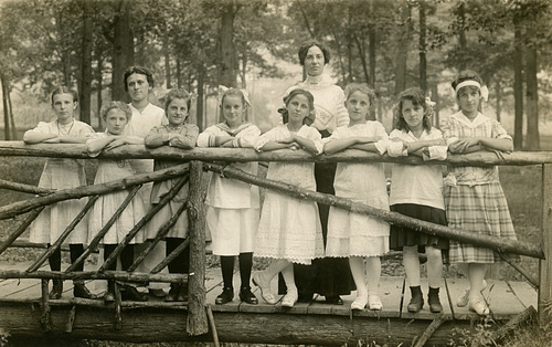 Girls and Women on a Rustic Bridge