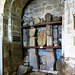 bakewell  church, derbs (9)early c12 arch at the west end of the north aisle, designed to open into one of two western towers as at  melbourne, now full of saxon fragments and early c13 grave markers