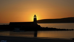 Port Logan Lighthouse at sunset