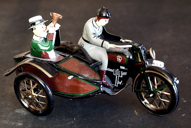 A Tin Motorcycle Toy.