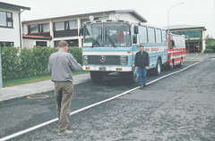 The owner of Hotel Mosfell takes a photo of our driver with his coach - 24 Jul 2002 (492-09)  (Photo 4 in a set of 5)