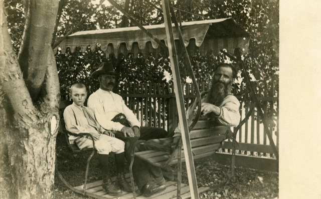Three Guys on a Glider Swing