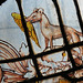 rousham church, oxon ; crest of a wolf with a wing in its mouth, part of the c17 dormer glass