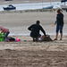 Braving the wind - a family trying to make a sandcastle