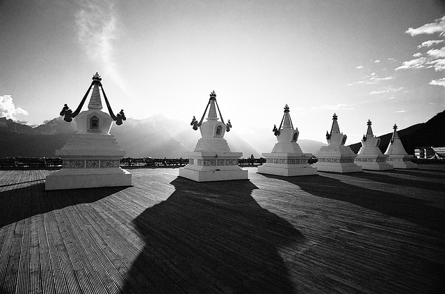 Sunset view on stupas on a Himalayan boardwalk