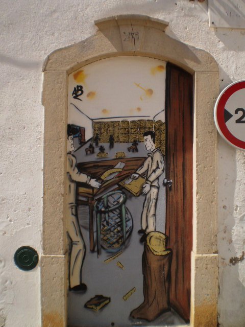 Street art on walled door.