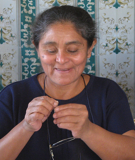 A smile while threading a needle