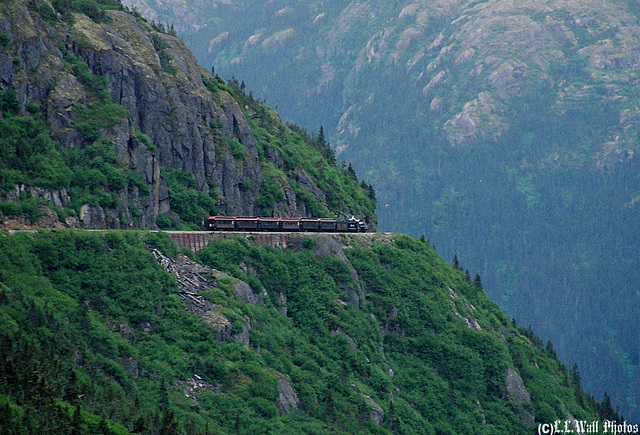 Alaska Landscape Dwarfs Steam Locomotive and Passenger Cars