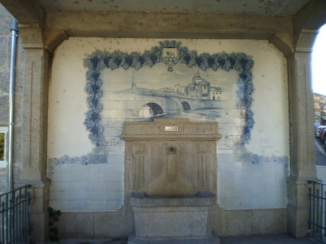 Fountain with tiles panel.
