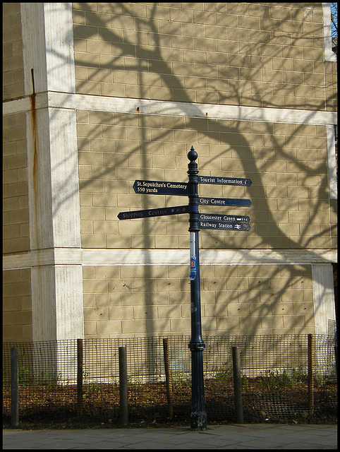 signpost and shadows
