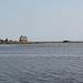 Деревянная Никольская часовня и каменный сарай на островках у Карельского берега Белого моря
