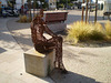 Sculpture of sitting woman.