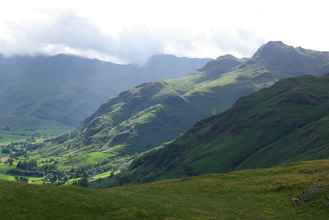 Crinkle Crags and Bowfell in cloud beyond The Langdale Pikes