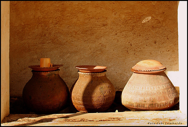 three pots and a cup