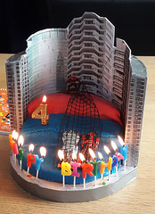 Spiderman cake with candles alight