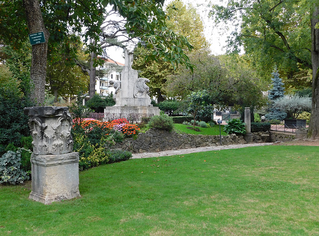 Roman Capital and the Monument to Michel Servetus by Joseph Bernard in the Public Garden of Vienne, October 2022