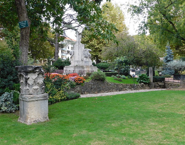 Roman Capital and the Monument to Michel Servetus by Joseph Bernard in the Public Garden of Vienne, October 2022
