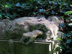 abney park cemetery, london,a disembodied hand once pointed to the bible, its finger now shorn of its tip