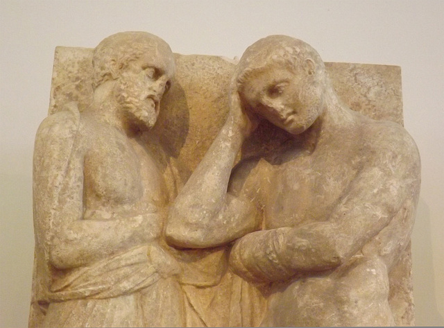 Detail of a Grave Stele from the Kerameikos in Athens with a Young Man, his Father and a Slave in the National Archaeological Museum of Athens, May 2014