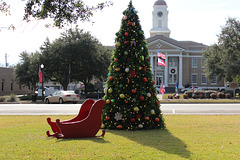 Santa's Sleigh beside one of the Trees in our down town parks... County Courthouse in backgroud.... MERRY CHRISTMAS !!