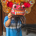Small boy Aswin wearing Barong mask