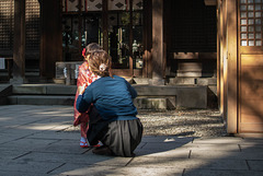 Girl in pretty kimono with her mother