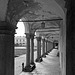 The succession of arches and columns of the cloister of Oropa, Biella