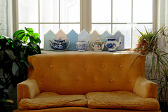 Orange Sofa with Teapots