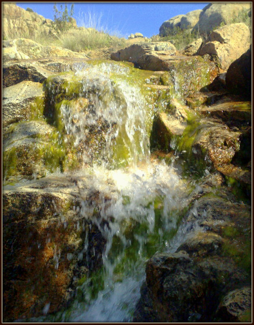 Mountain stream. Seasonal waterfall