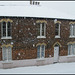 English house in the snow
