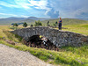Yet another of General Wade's old bridges with the Monadhliath mountains in the background
