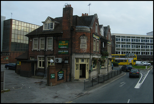 old pub surrounded by carbuncles