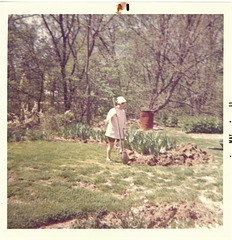 Betty, expanding in her garden, May '69