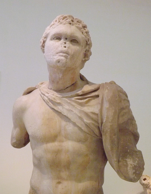 Detail of a Statue of a Youth Wearing a Chlamys in the National Archaeological Museum in Athens, May 2014