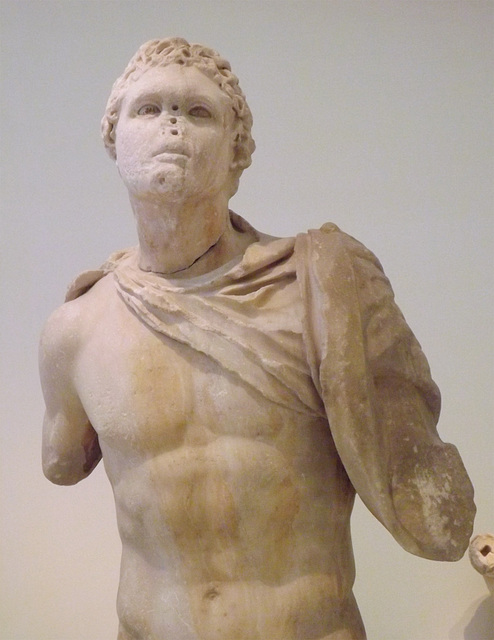 Detail of a Statue of a Youth Wearing a Chlamys in the National Archaeological Museum in Athens, May 2014