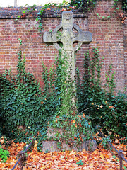 brompton cemetery, london,early c20 cross with resurrection carved between angels on the head