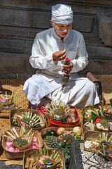 Pemangku priest takes holy rituals for the Gods