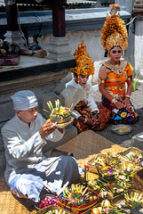 Pemangku priest blessing the couple