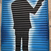 Street art on blinds of door.