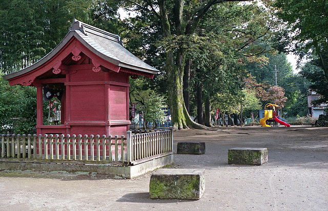 Red shrine by the playground
