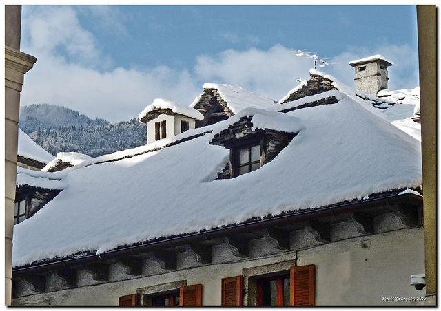 Roof with snow and sun