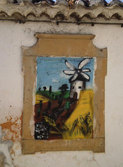 Street art on walled window.