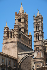 Arch over Via Matteo Bonello, and some ornate towers