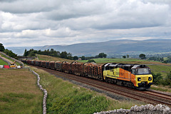 COLAS RAILFREIGHT class 70 70814 with 6V38 12.46 Carlisle - Chirk loaded Logs at Greengates 13th July 2019.