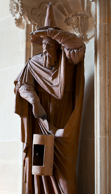 Wizard with pointy hat and lamp - statue at Lacock Abbey